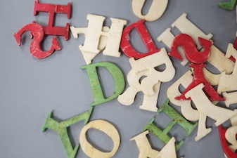 Boxed stained ivory letters, 19th century